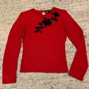 Lightweight red sweater with black embroidered flowers on front